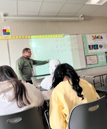 Dowling teaches his students about different formulas and methods to help his students prepare for their test. 