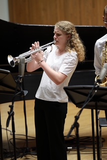 One of the many performances where Comeaux blows the crowd away with her trumpet.