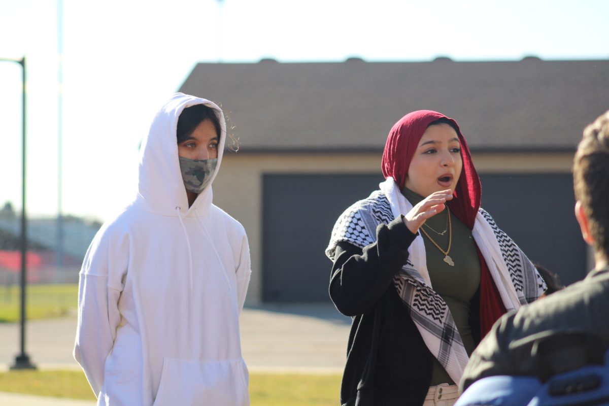 Seniors Jahnavi Sachchidanand and Noor Ethawi address the group of students leading the walkout.