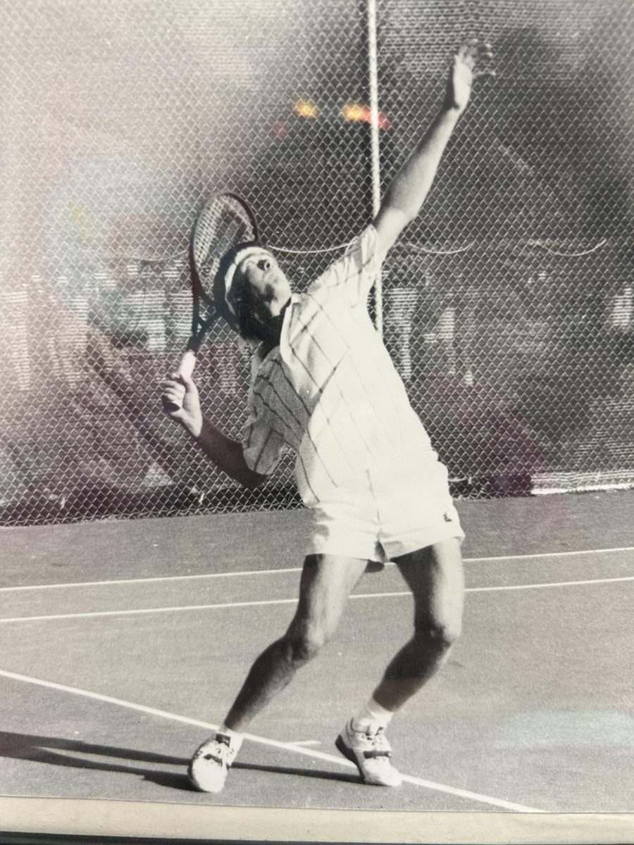 Kris Grabner playing tennis at one of his college games.