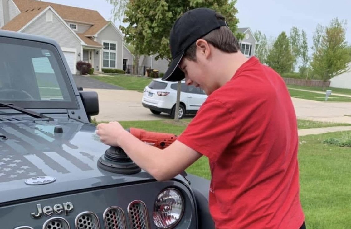 Andrew finishes up his work on a Jeep.