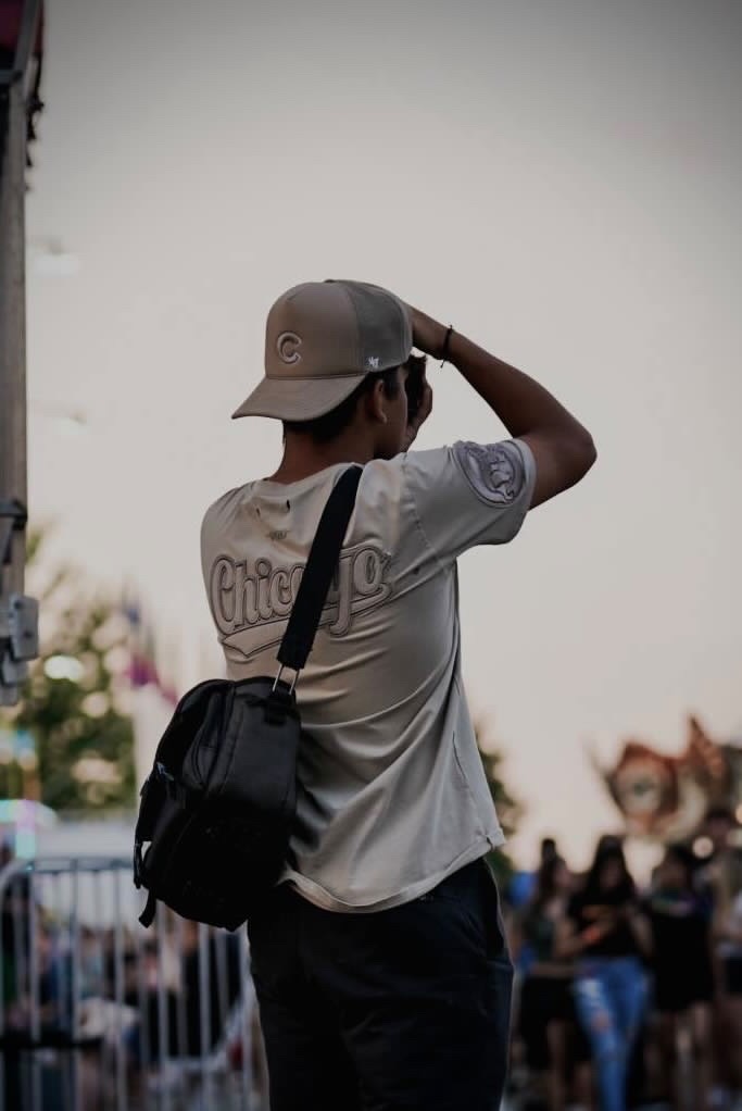 Photographer Jesus Serrano photographing Huntley’s Sunset Fest in August, starting his newfound passion for photography.
