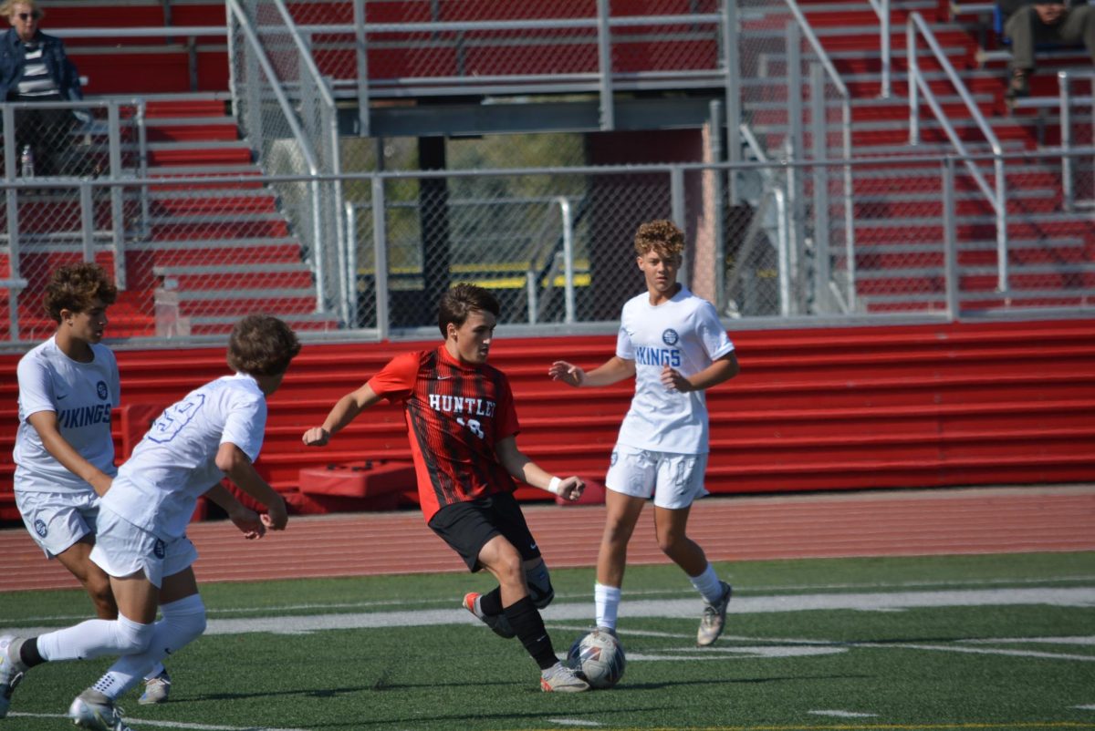 Player Max Connel avoids the Geneva defenders.