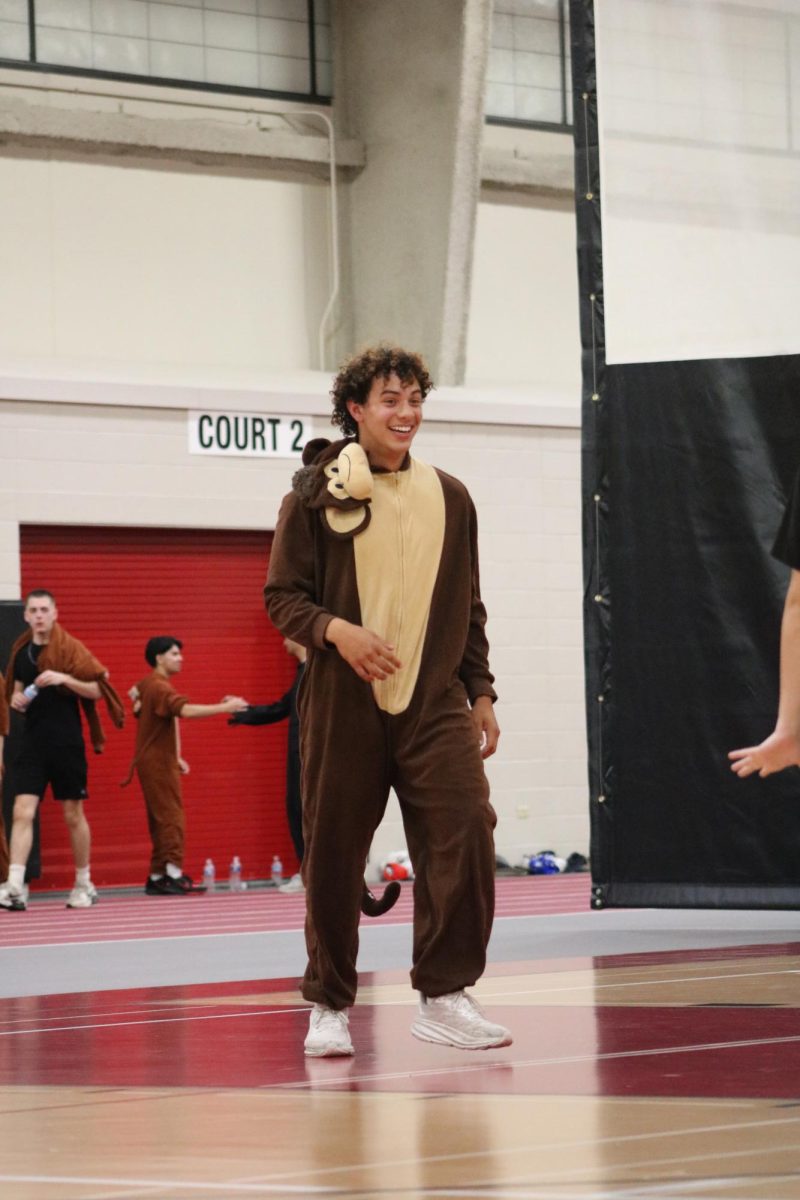 Senior Braylon Bower, part of the "Braylon's Bananas 2.0" Group, plays on the court during a match.