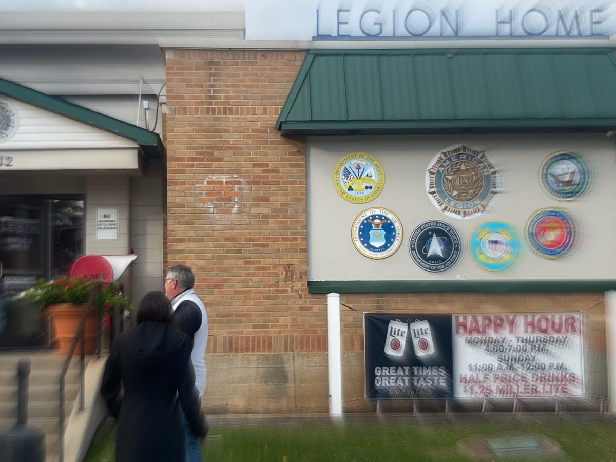 Community members entering Huntley’s Legion Hall Indoor Farmers' Market to enjoy the activities.