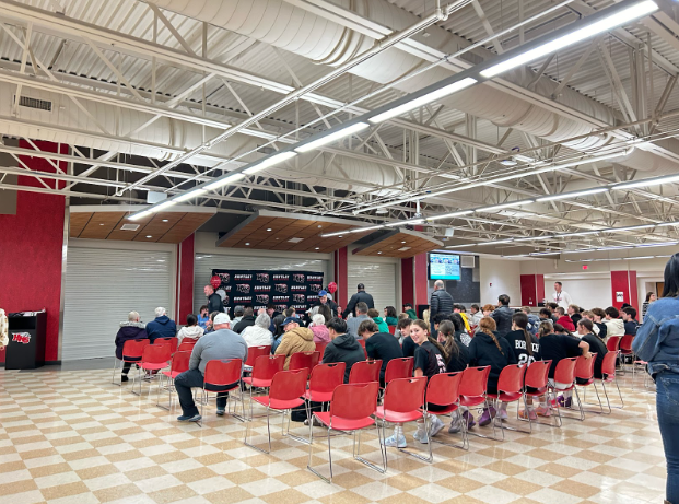 The cafeteria is filled by parents and friends eager to celebrate the work done by high school athletes they know.