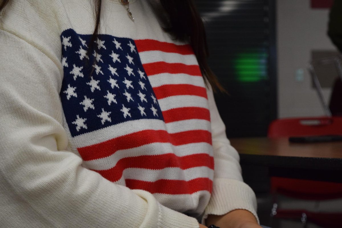 One of many sweaters and articles of clothing featuring the American flag worn by attendees. 