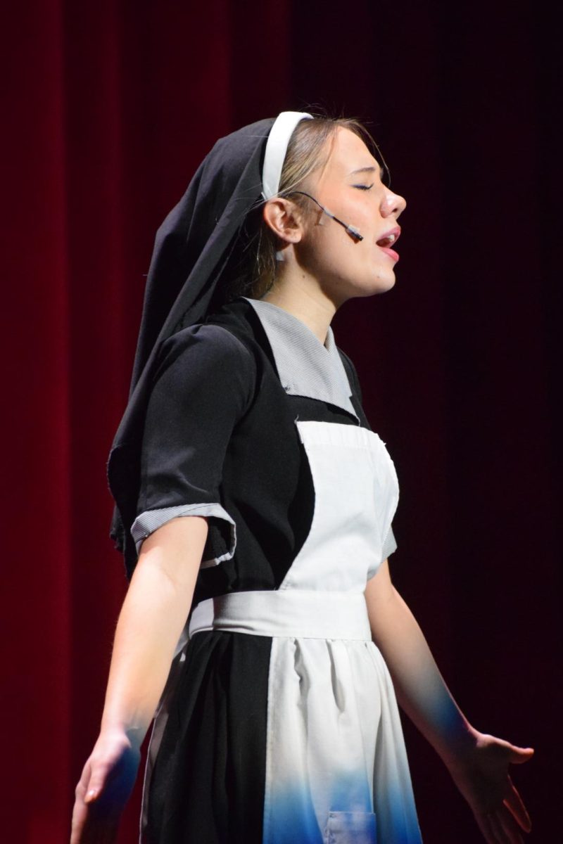 Claire Darshewski as Maria singing "Sound of Music". 