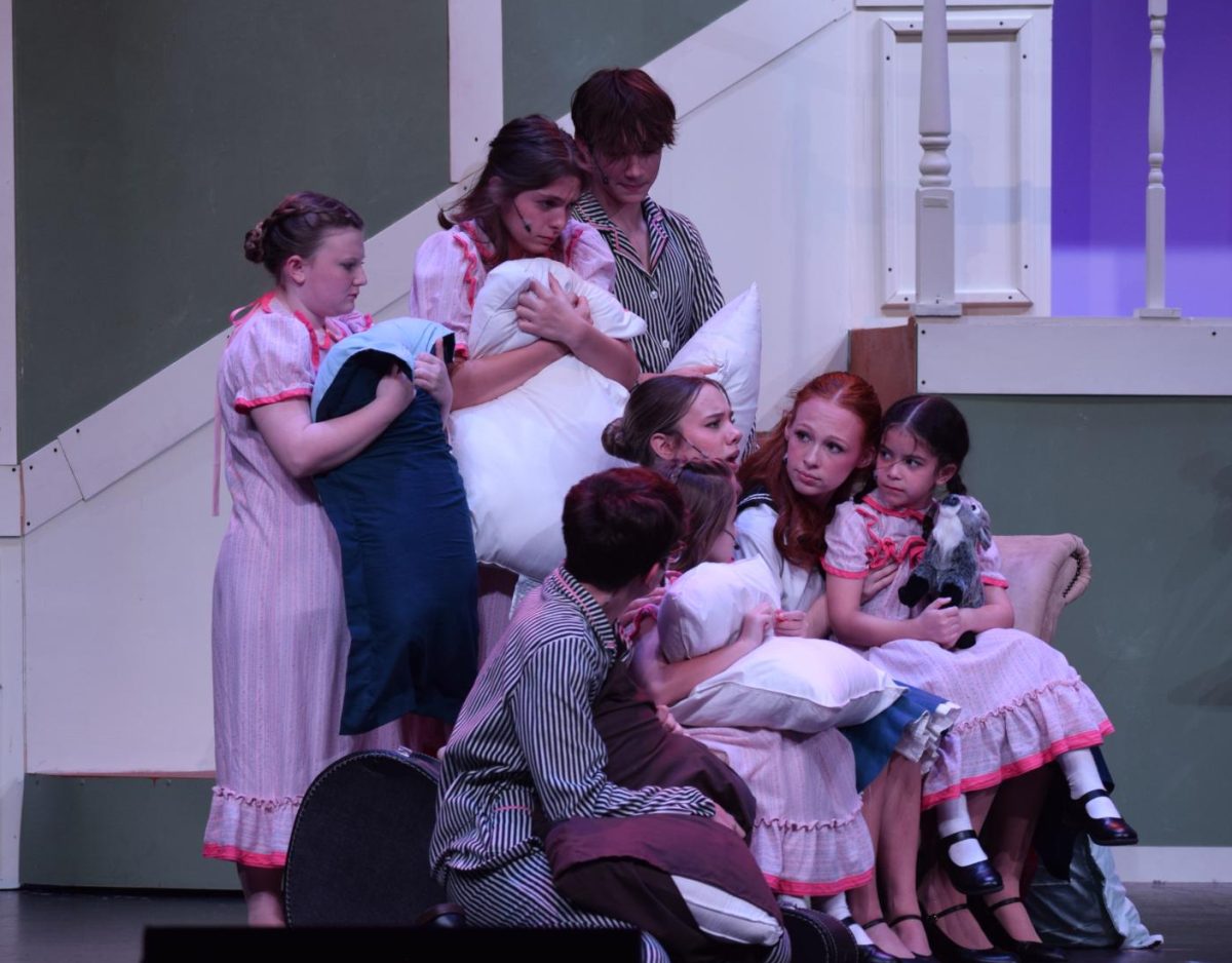 Maria and the Von Trapp children huddling from a thunderstorm. 