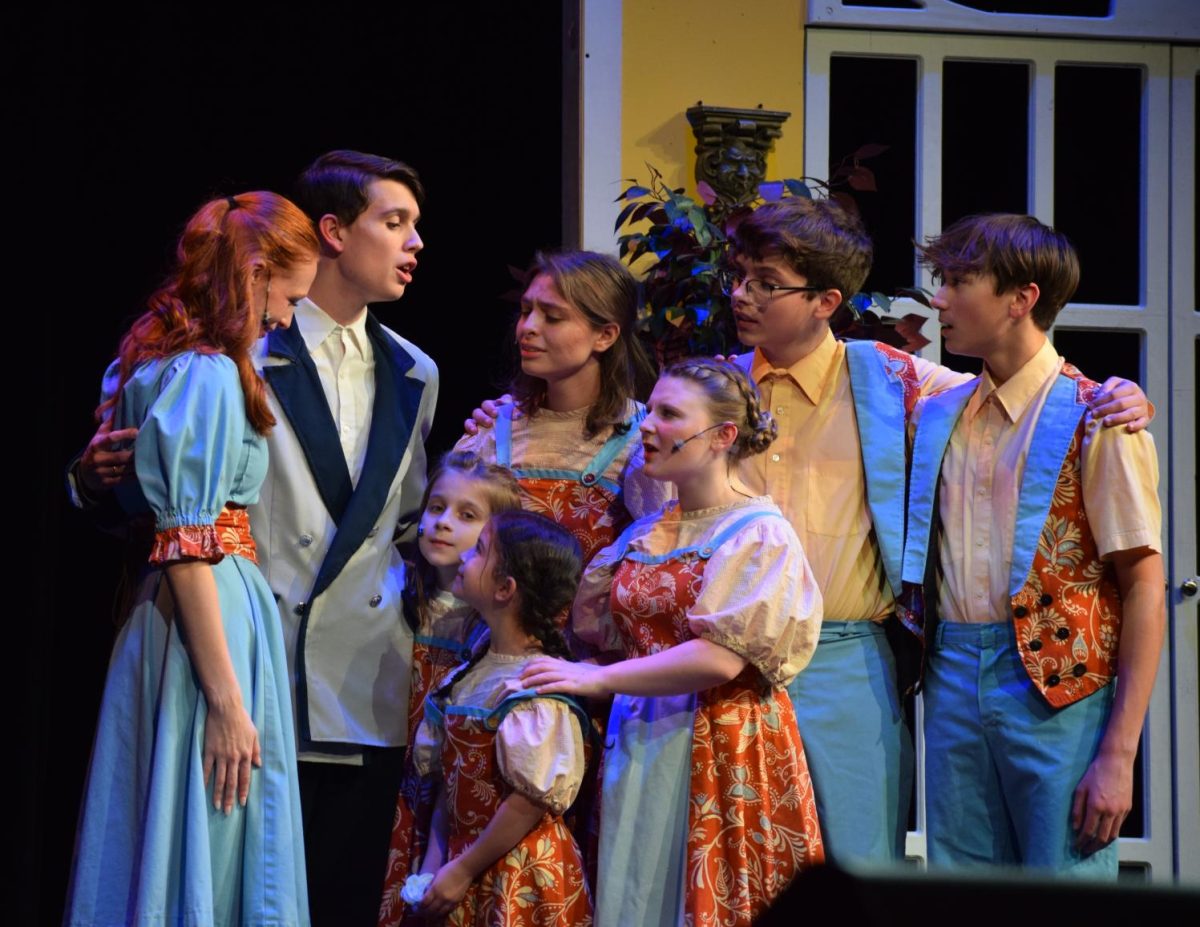 The Von Trapp children with their father Captain Von Trapp, played by Bobby Zimmerman. 