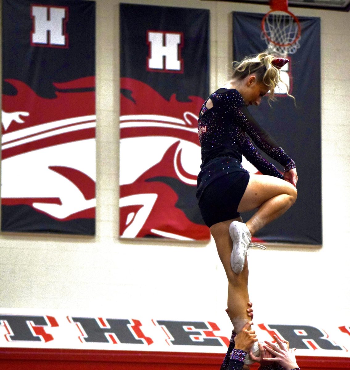 Sophomore flyer Natalia Koczur in her stunt. 