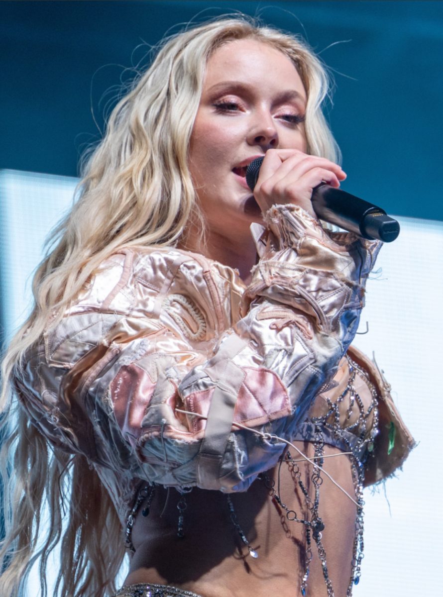 Zara Larsson singing on stage.