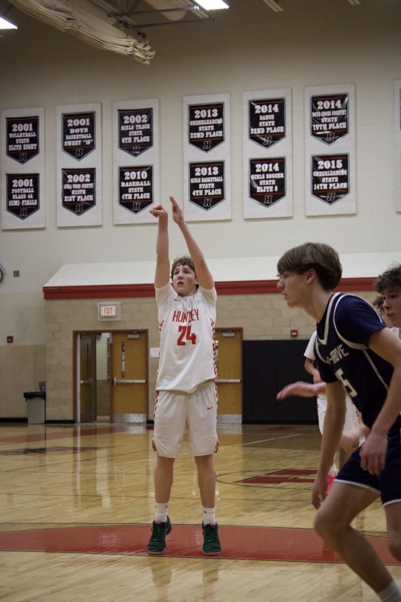 Evan Cambell shooting the ball at the free-throw line.
