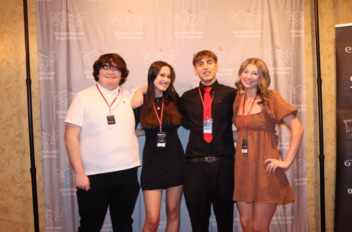 Addison Stone (right), Harmony Yearbook editor-in-chief, poses with fellow TV Production editors at the Student Silent Film Festival. Stone is also competing for Illinois Journalist of the Year.